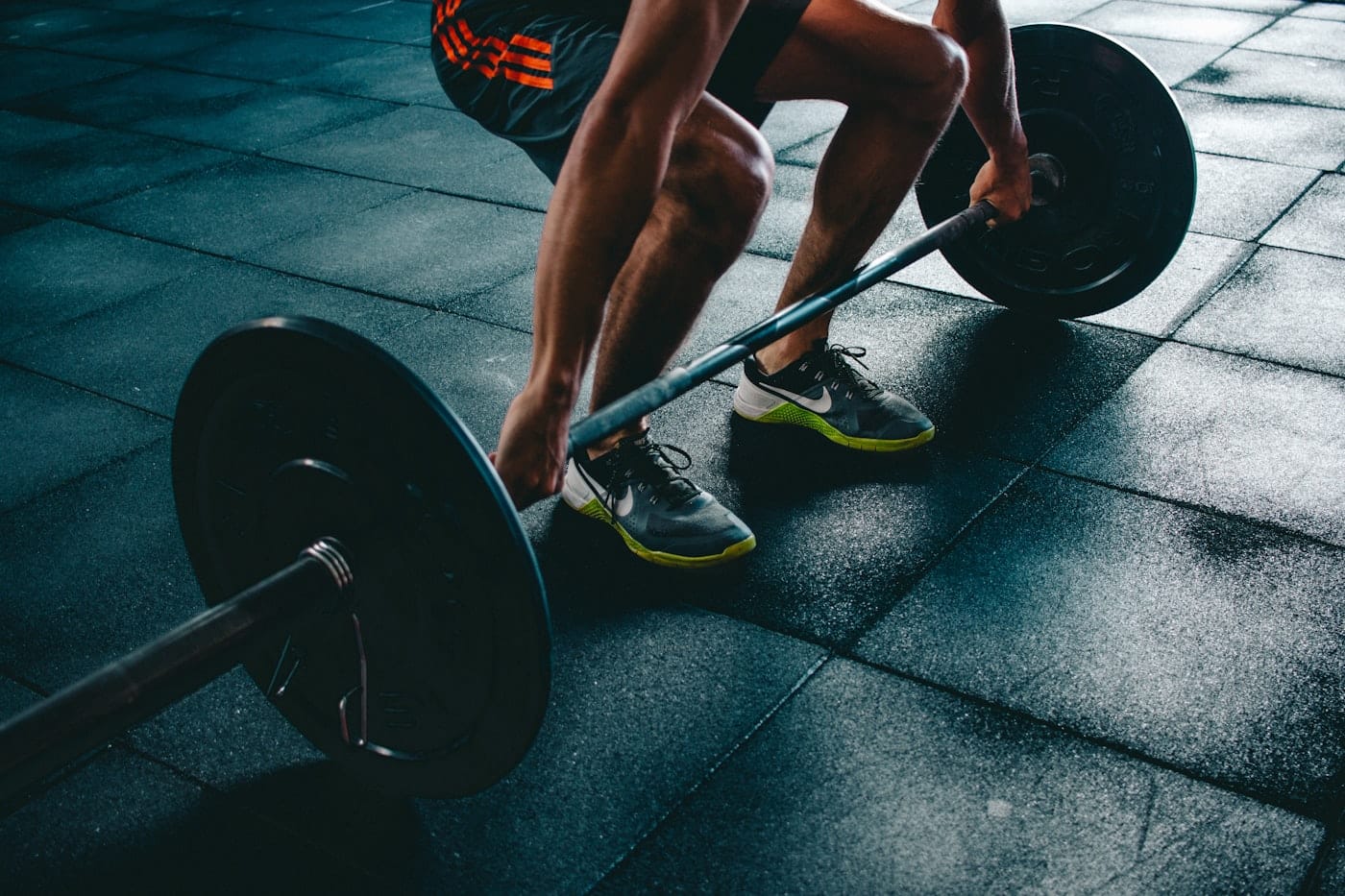 Man training in a gym, looking focused