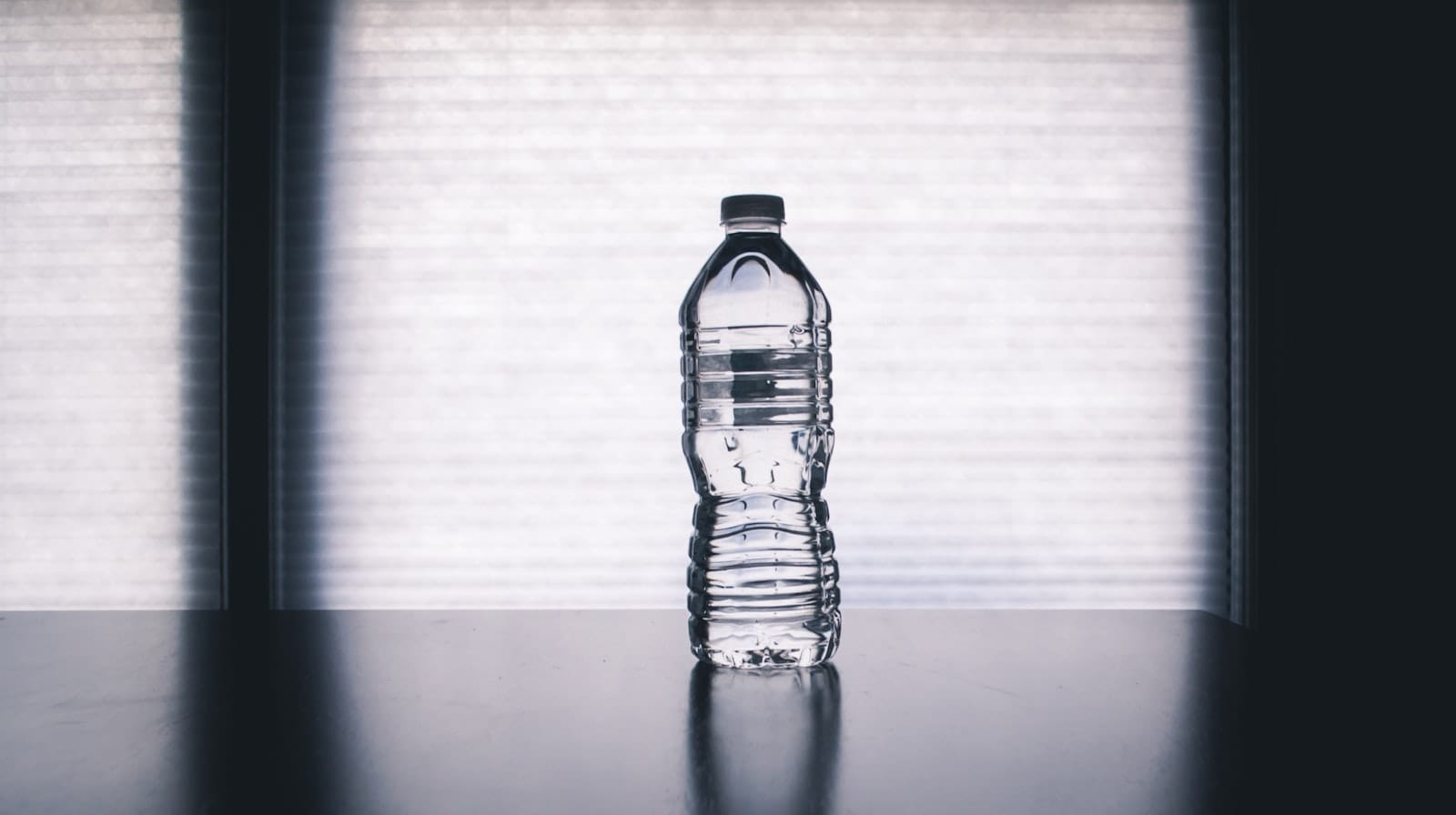 Men 40+: The Morning Routine That Fixes Low Energy 2 Water glass on a kitchen counter in morning light