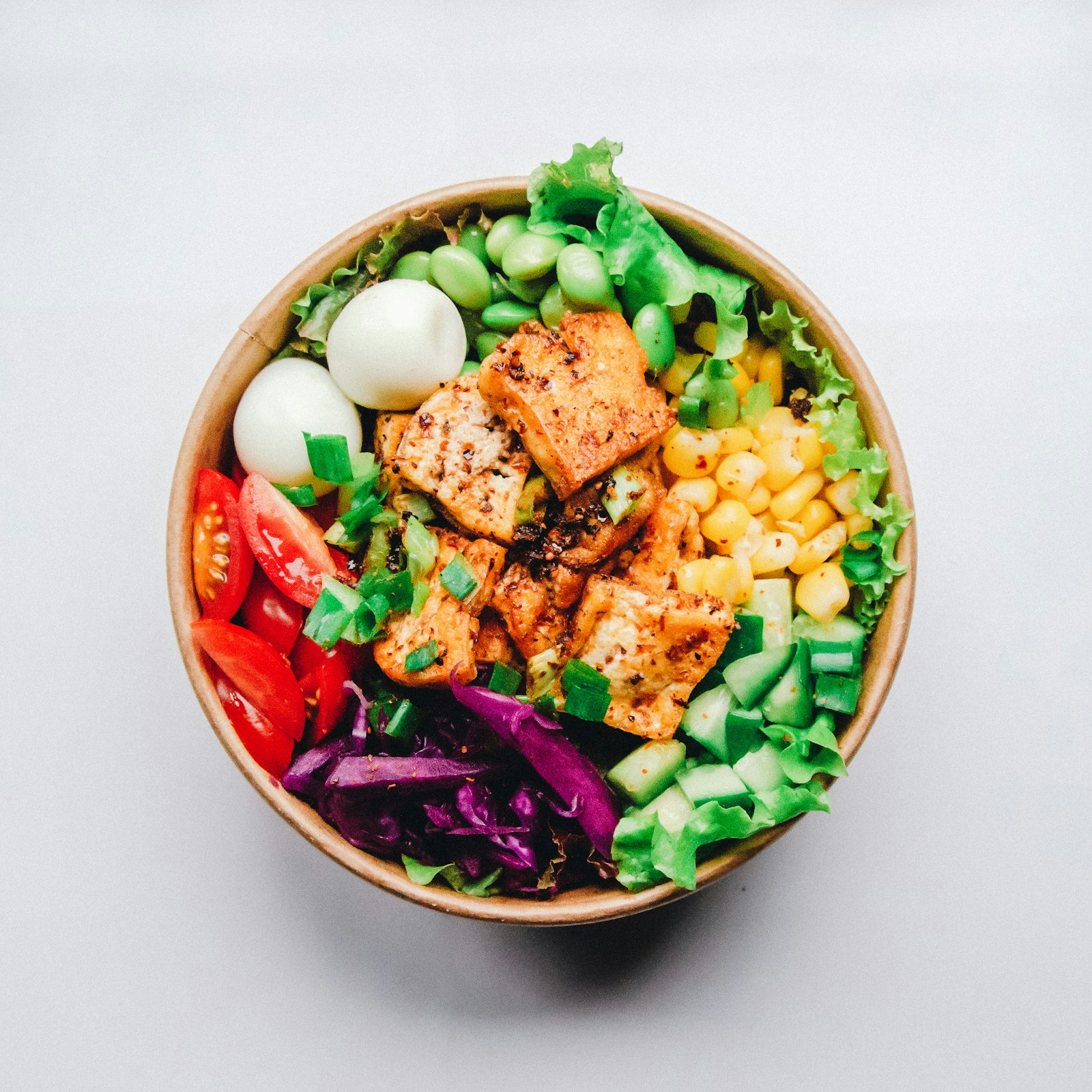 Simple plate with rice, chicken, and vegetables on a table